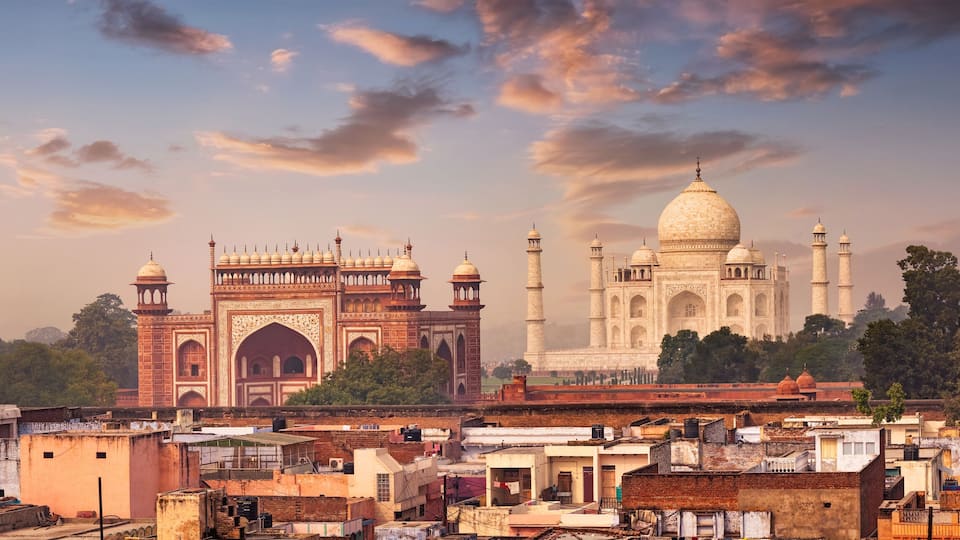 The Taj Mahal with surrounding Mughal architecture, including the Red Fort and the Agra Fort.