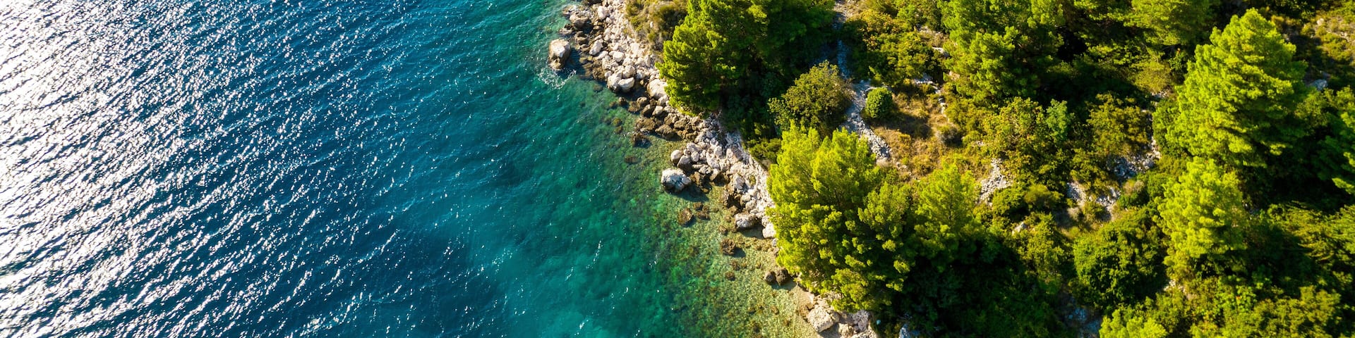 Croatia. Aerial view on beach and people. Vacation and relax. Beach and blue water. Top view from drone at beach and azure sea. Travel and holiday