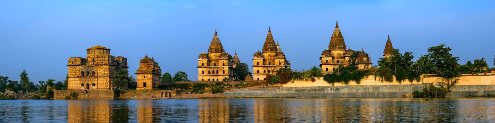 View of Royal cenotaphs (Chhatris) of Orchha over Betwa river. Orchha, Madhya Pradesh, India.