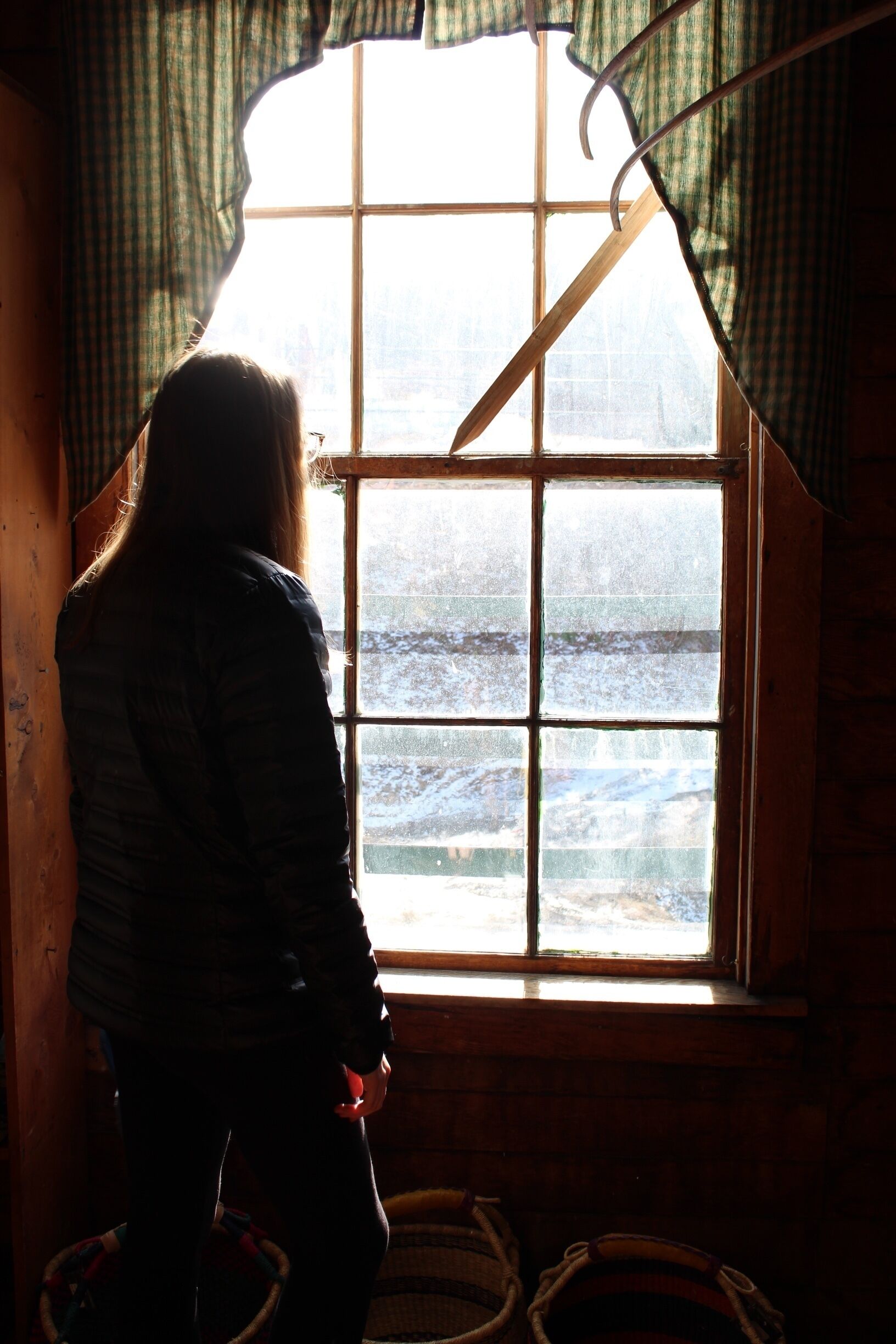 This is a picture of my roommate, Emily looking thoughtfully out the window at the Mast General Store. This picture is one of the more "stereotypical" ones I have taken. It is almost completely "rustic" looking. There is the old, wooden window, with dated valances. There are woven baskets at her feet and the window looks as if it could have been put together by hand. The only modern aspect of this could be Emily herself. She almost looks out of place with her winter coat and leggings. This picture implies to me that the people themselves make Appalachia modern. They shape it into what they want and breathe new life into the region. #appalachianechoes 