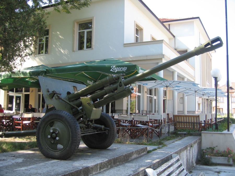 An extremely rural town, old and quiet, no statues, but the old artillery weapon sitting in the town square.