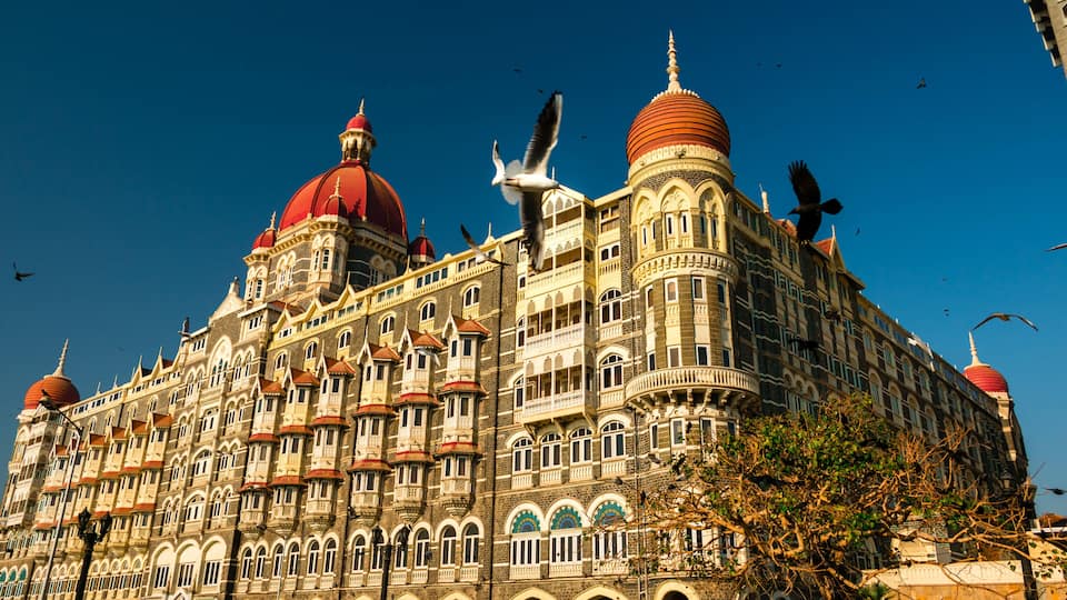 A grand building with multiple domes and intricate architecture.