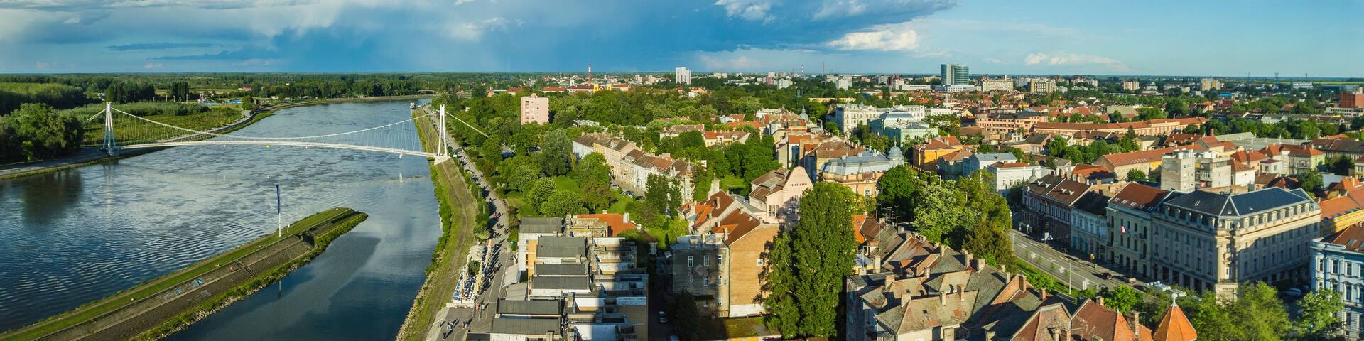 Osijek, Croatia: Wide panorama of city, river Drava and Pedestrian bridge