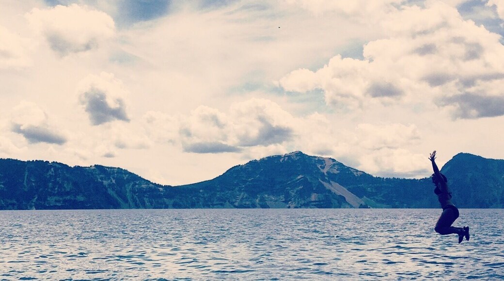 Hike 2.2 miles roundtrip to the bottom of Crater Lake in Oregon and jump off an 18 foot rock for some icy adrenaline fun!