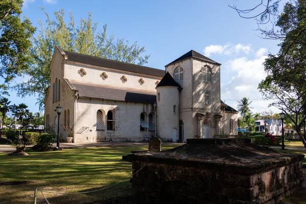 A historic church with a bell tower and arched windows.