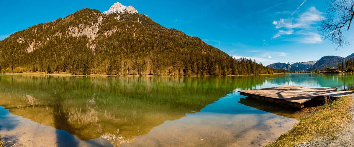A mountain lake with a wooden dock.