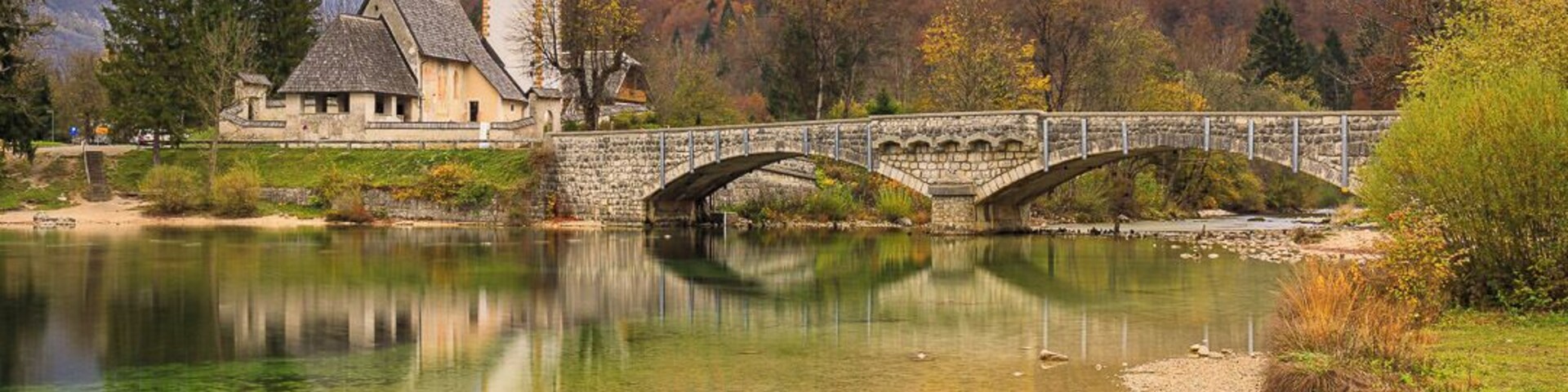St John the Baptist's Church, Ribčev Laz (Cerkev Sv. Janeza Krstnika) at the end of Lake Bohinj (Bohinjsko jezero).
This is a fascinating area. The waters around here are crystal clear both in the rivers and lake. In the lake they have a green tinge, due to the minerals in the water I assume. Well worth a visit.