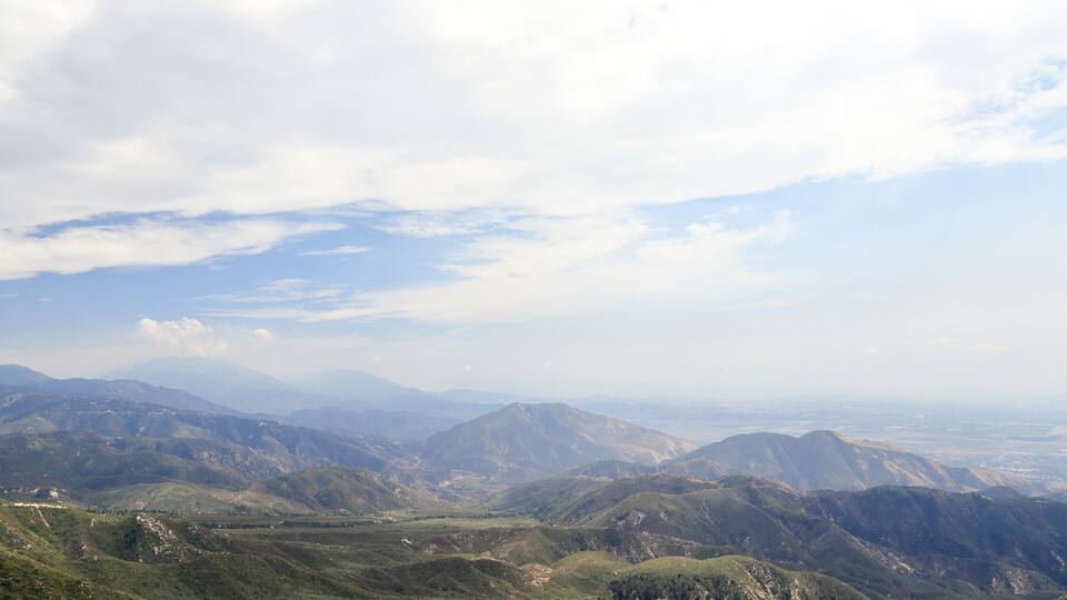 A mountainous landscape with rolling hills and valleys.