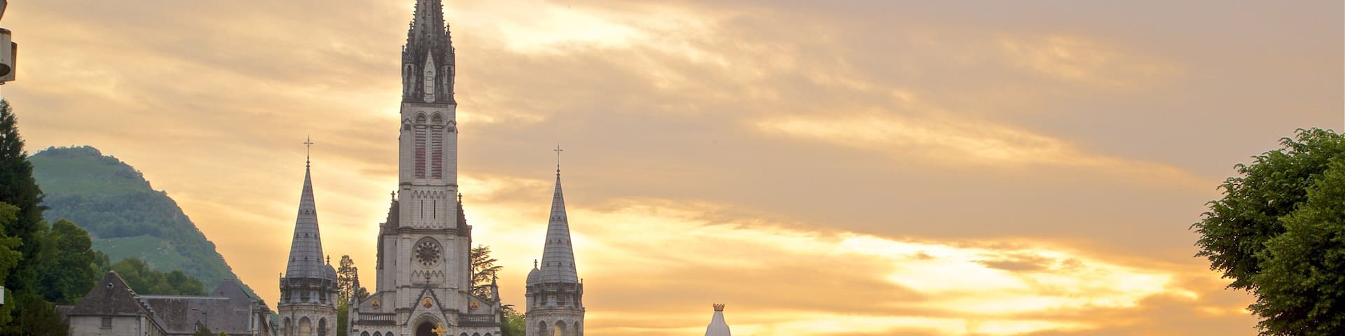 Lourdes - Tarbes which includes a church or cathedral, heritage architecture and a sunset
