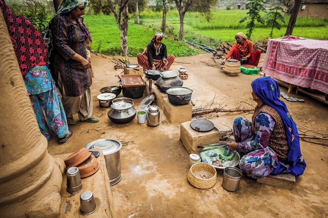 Outdoor lunch preparations, courtesy of the village women at Mangar.
Rotis (chapatis) being cooked over a 'chulha' cooking stove, heated by burning wood, charcoal or cow dung.