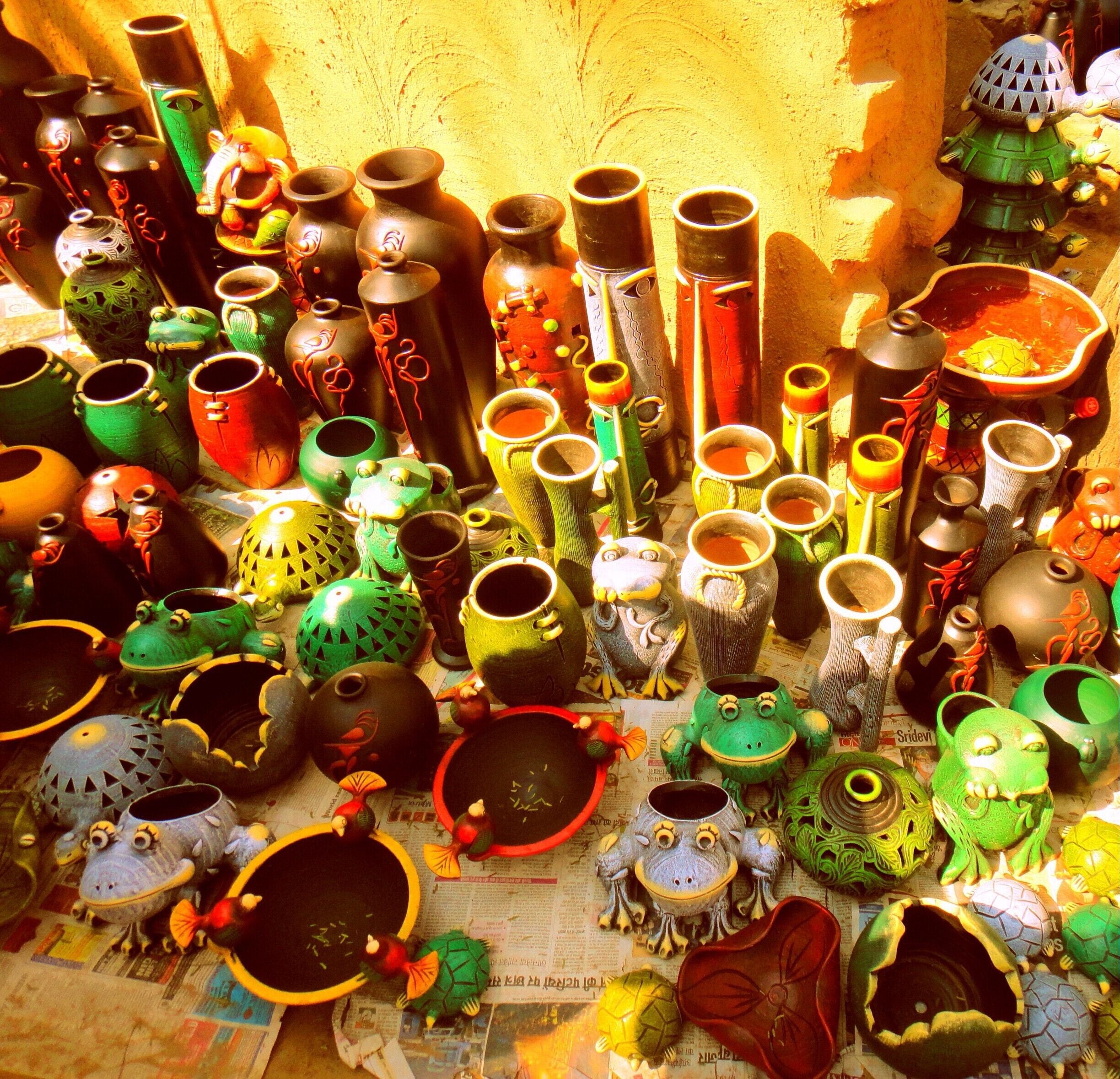 Surajkund Fair – It is an international crafts fair that is held in Faridabad, India, every year in the month of February. Crowded and colorful. You get everything ranging from a key-ring to bed sheets.

I could sit and paint those cute little things for hours.

#Market #colorful