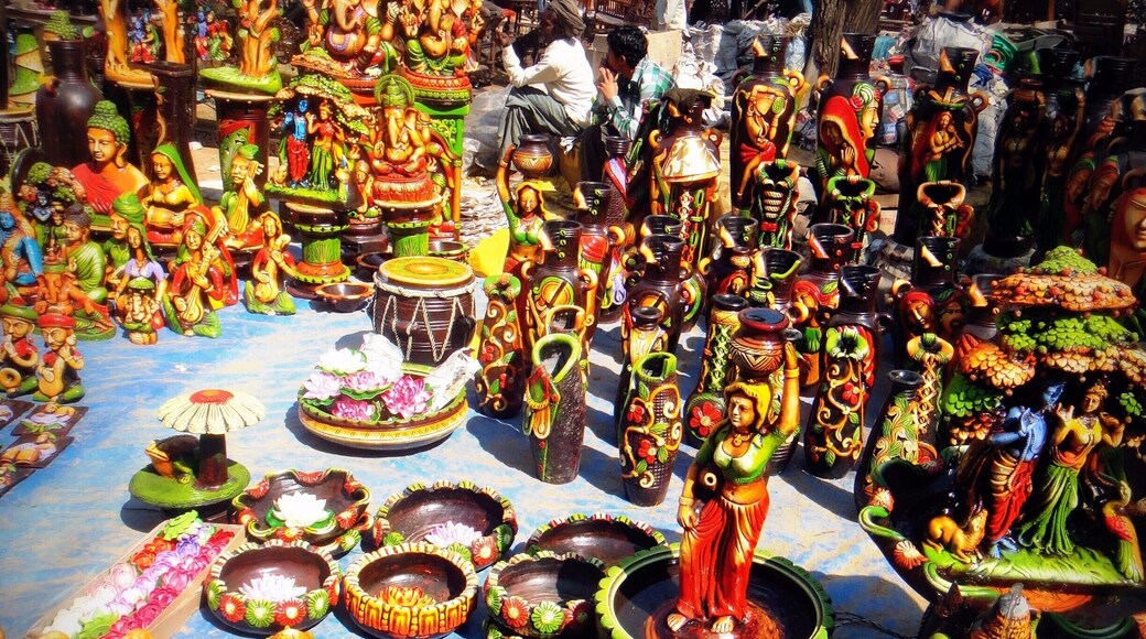Surajkund Fair â It is an international crafts fair that is held in Faridabad, India, every year in the month of February. Crowded and colorful. You get everything ranging from a key-ring to bed sheets.
There are so many things in this picture â a Shiva sculpture with fountain at bottom right, a tabla (a percussion instrument), pots, vases, and even real people if you look closely. ;)
#Market