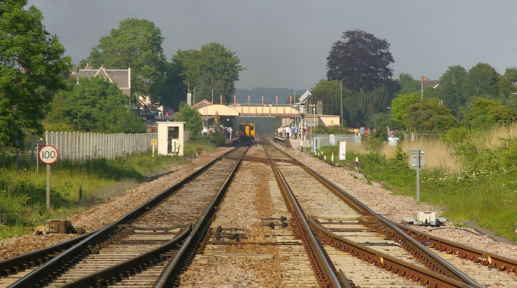 Looking east towards Yatton railway station from a level crossing. 150239 is leaving the station.