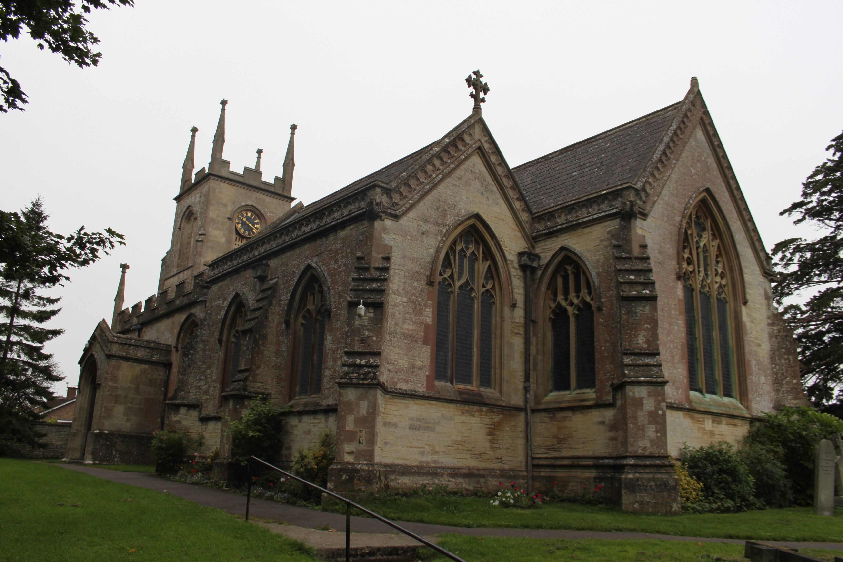 A historic church with pointed arches and a clock tower.