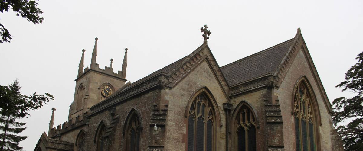 A historic church with pointed arches and a clock tower.