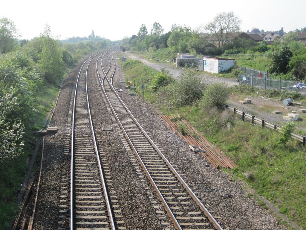 Wootton Bassett Junction railway station (site of). Opened in 1841 by the Great Western Railway on its line from London to Bristol, this station was rebuilt in 1903, and closed in 1965. View west towards the junction for South Wales and Bristol.