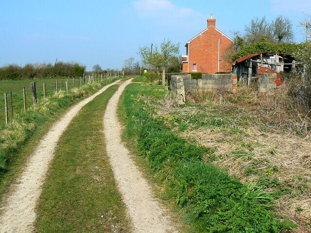 Track to Parkgate Farm, near Purton The track is also shown on the maps as a bridleway. The cottage is part of Lower Pavenhill Farm.