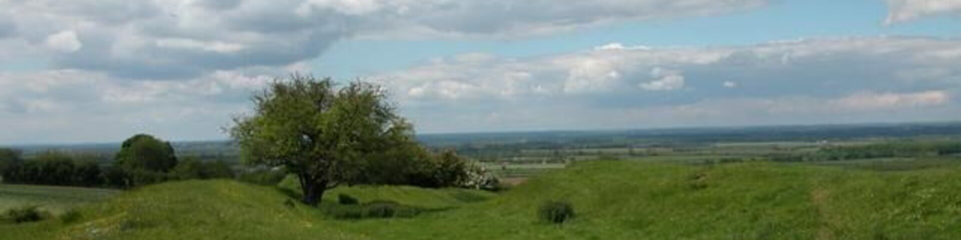 Ramparts of Castle Hill Fort looking North over the Thames Valley floodplain. The fort was constructed about 600BC however worked flints dating back to neolithic times have been found here suggesting human occupation dating back to 4500 BC.