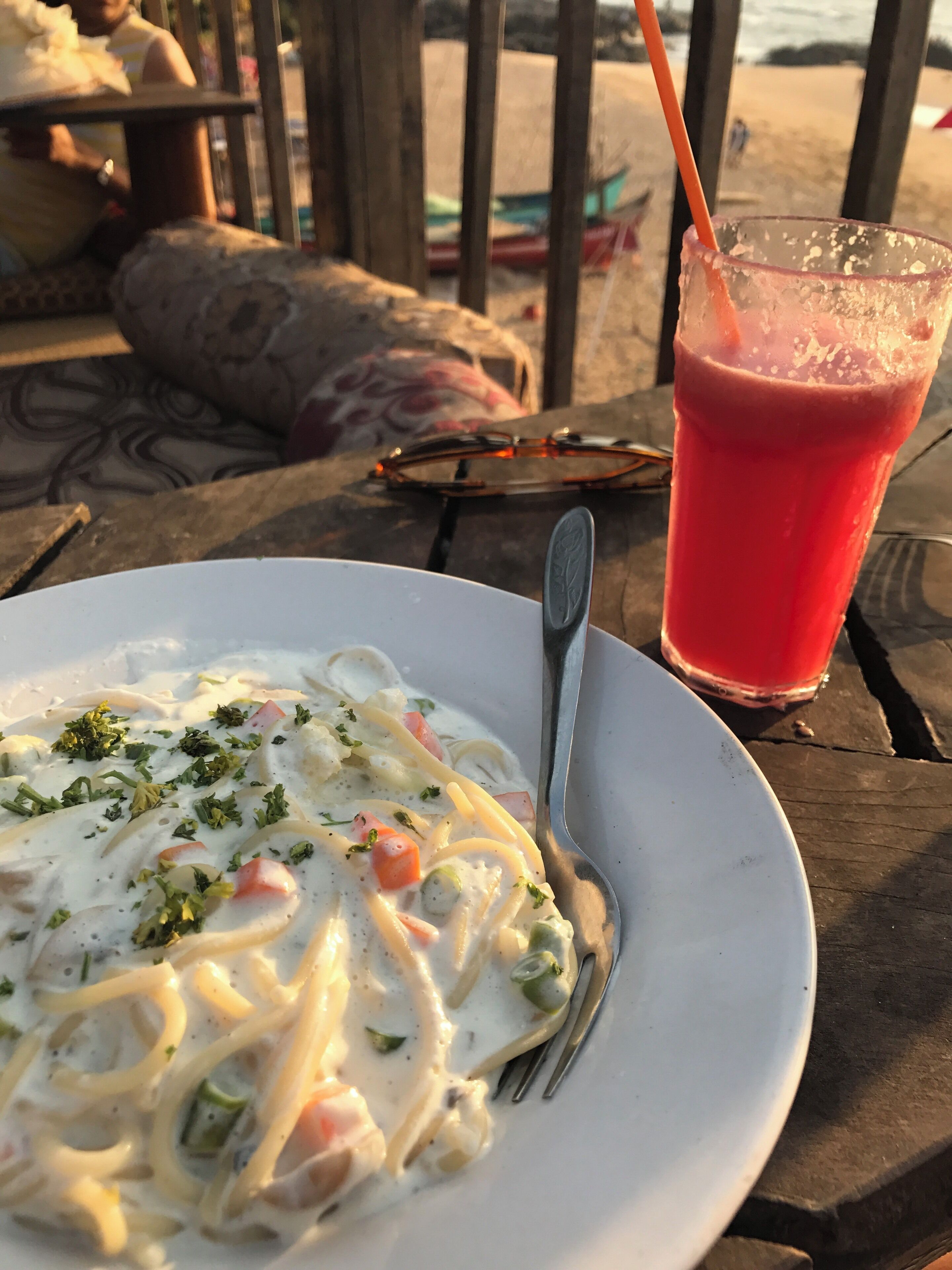 Spaghetti with salmon and cream, watching the sun setting over the ocean. Perfect!