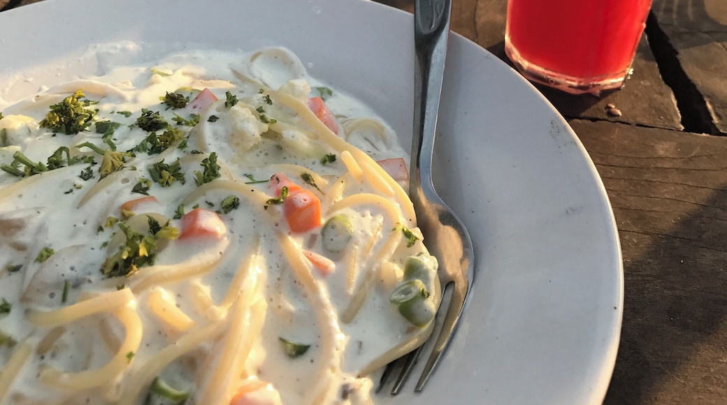 Spaghetti with salmon and cream, watching the sun setting over the ocean. Perfect!