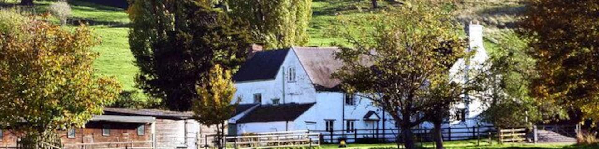 Abbotswood Farm near Brockworth View towards the farmhouse with Coopers Hill behind.