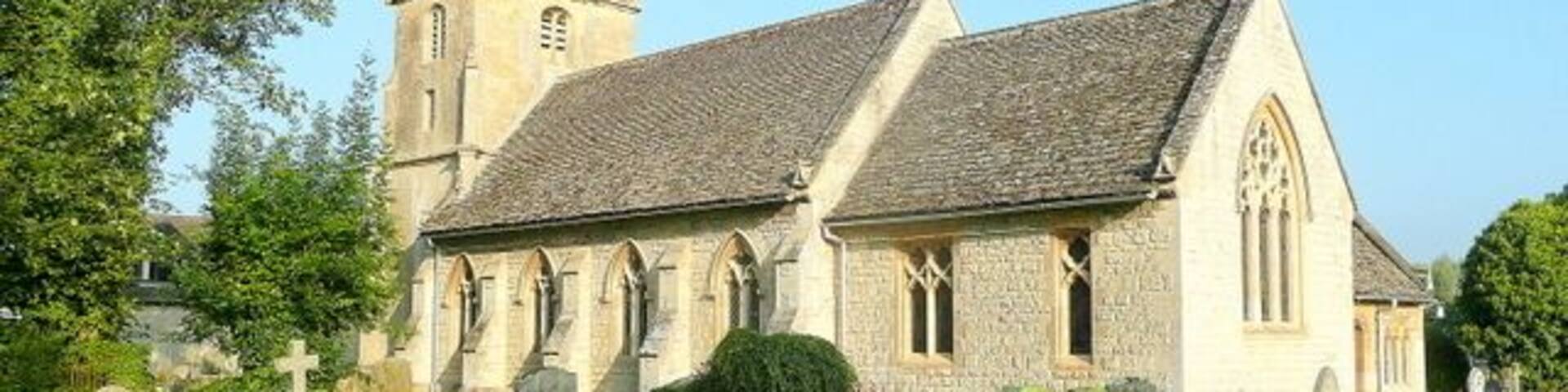 A church with a tower and a graveyard.