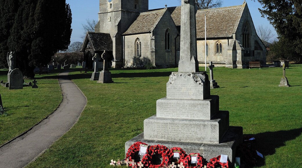 St James' parish church, School Lane, Quedgeley, Gloucestershire. In the foreground is the parish war memorial.