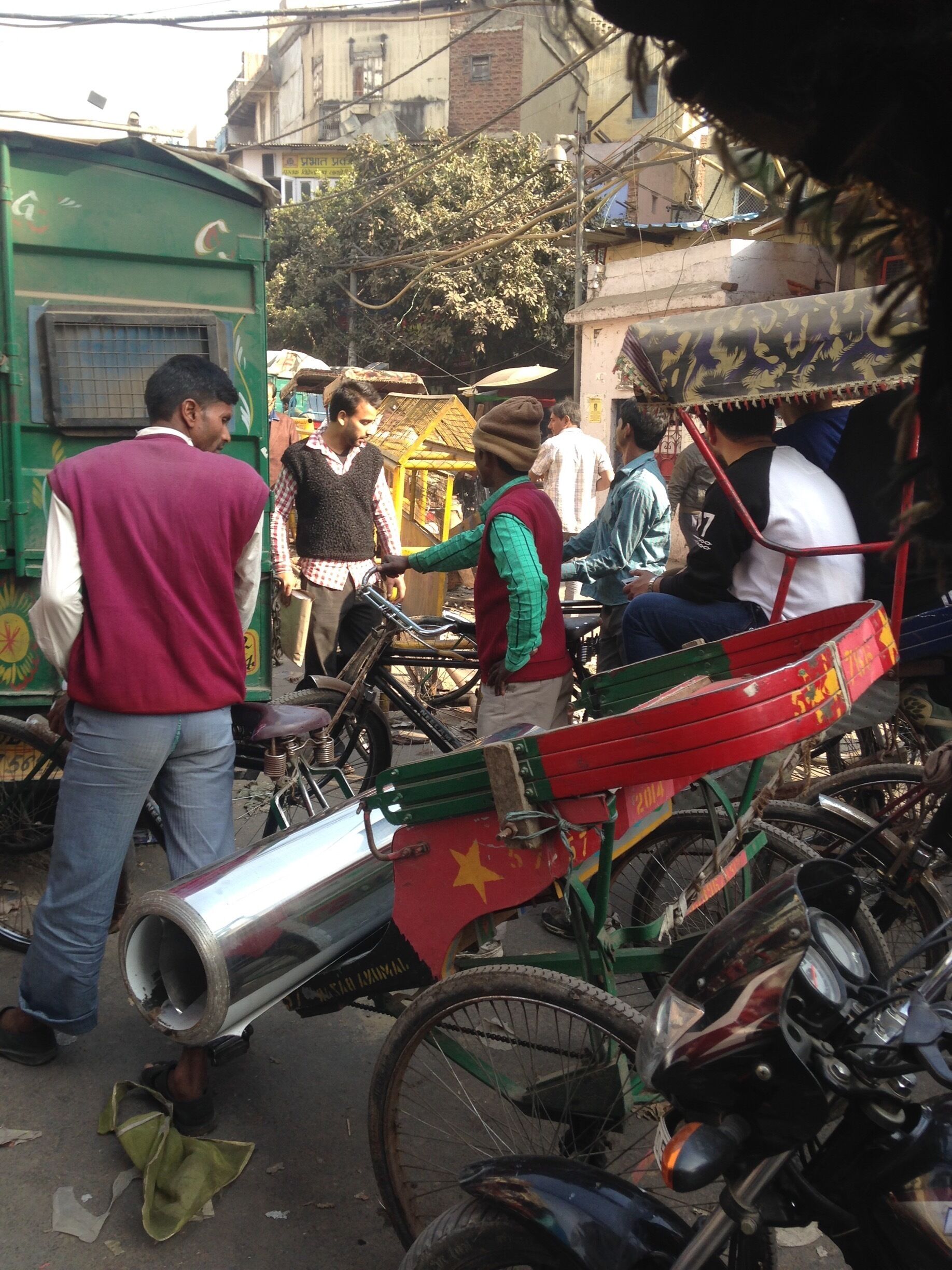 This is a traffic jam in the Old City of Delhi . We had to abandon the rickshaw and walk  . At the time the refuse workers were on indefinite strike due to the fact that they hadn't been paid for months . There were piles of rubbish everywhere . We were told that the locals deliberately threw rubbish out on the street in "solidarity " with the strikers