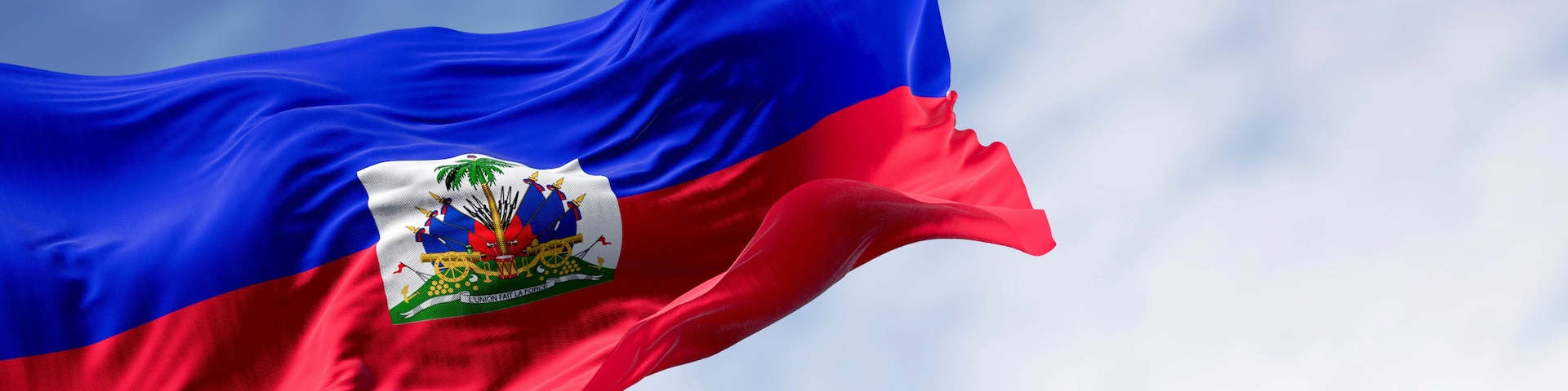 A flag with a blue field, a white field with a coat of arms, and a red field.
