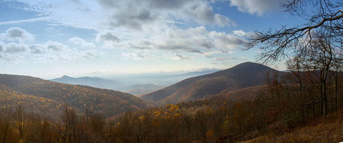 A mountainous landscape with autumn foliage.