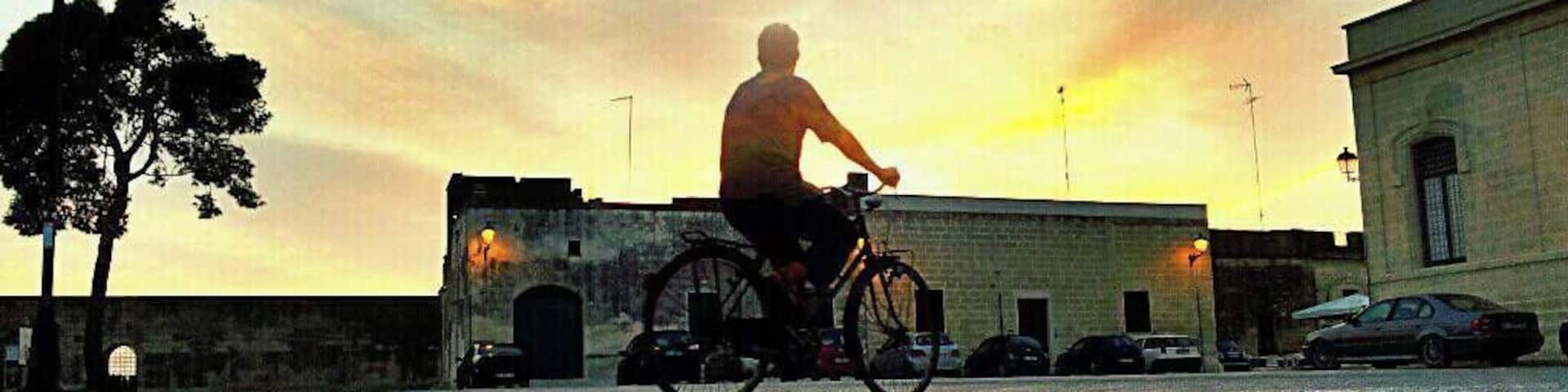 Biking in the sunset at Acaia, an italian village in Puglia region.