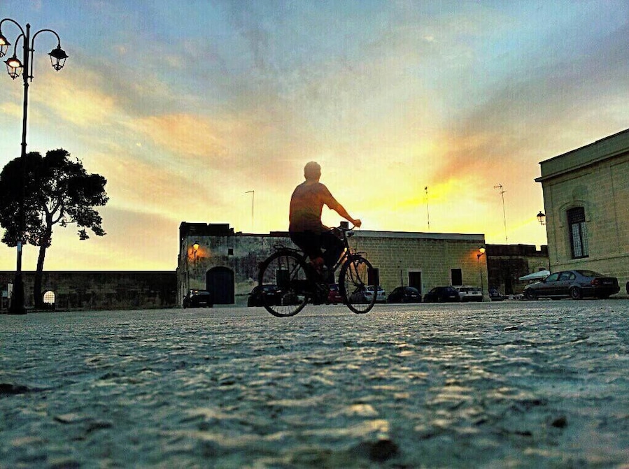Biking in the sunset at Acaia, an italian village in Puglia region.