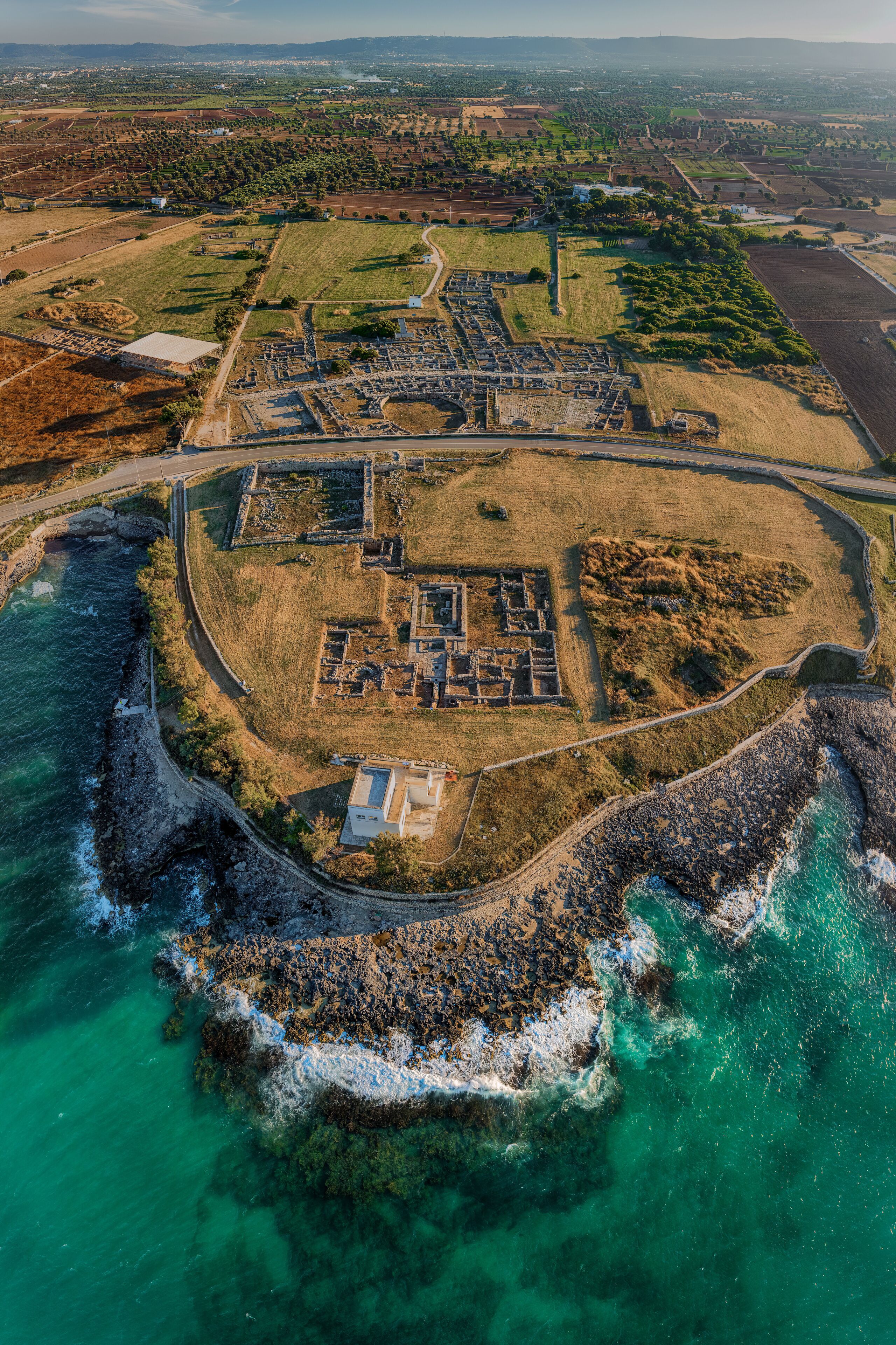 Flight over the port of ancient Engnazia, Fasano (BR) Puglia on the Adriatic Sea, an ancient port of Roman origin today an archaeological site. You can see the buildings of the city and the ancient po