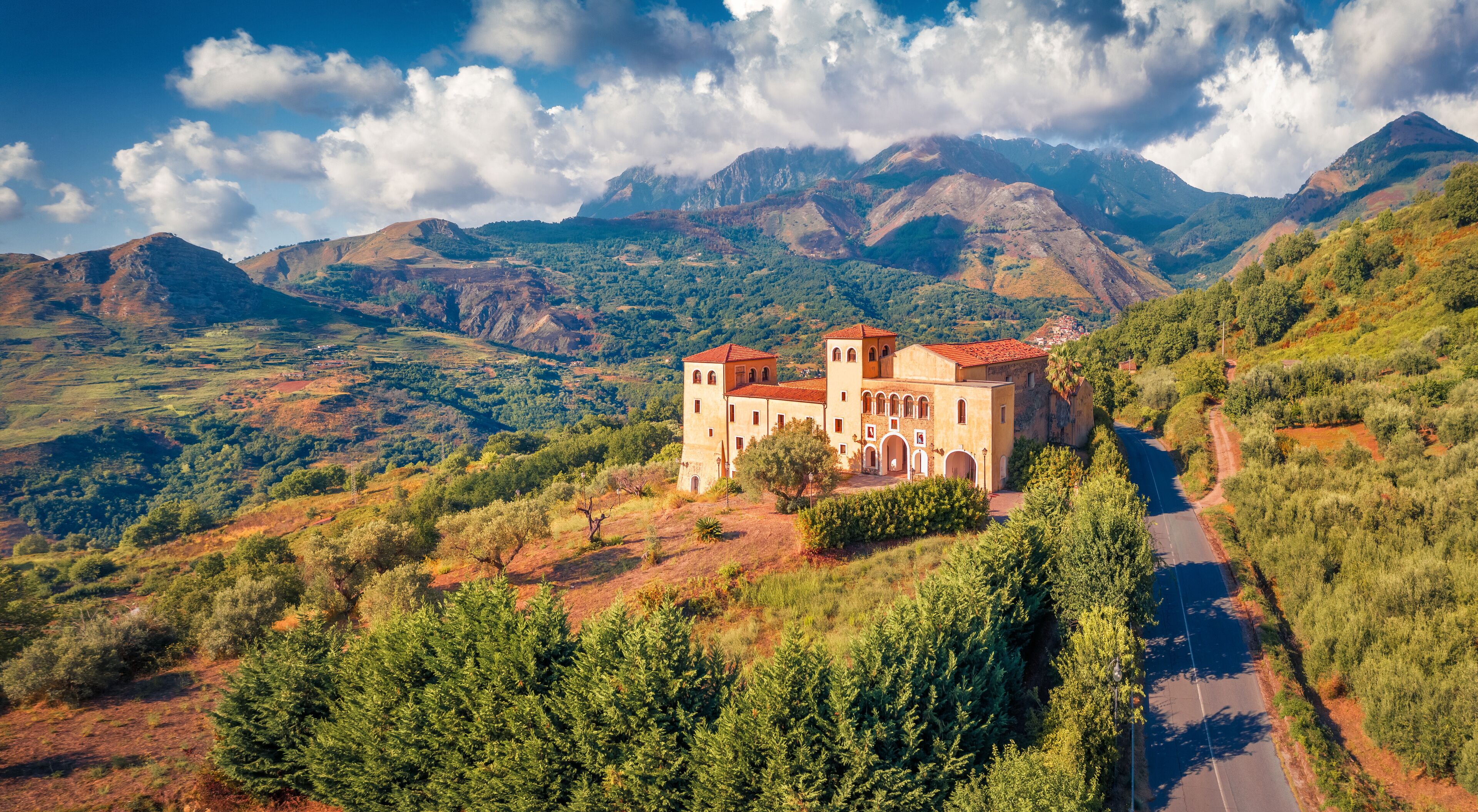 Amazing view from flying drone of typical Italian church, Bonifati village location, Province of Cosenza. Picturesque summer scene of mountains in Italy, Europe. Traveling concept background..