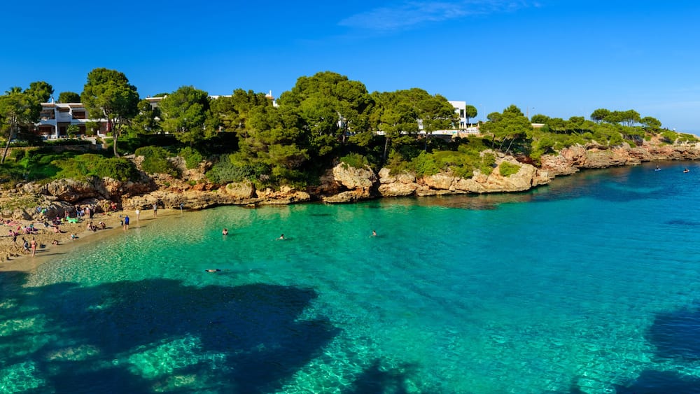 Beautiful wide panorama of Esmeralda beach in Cala d'Or on the coast of Mediterranean sea in Mallorca Balearic Islands