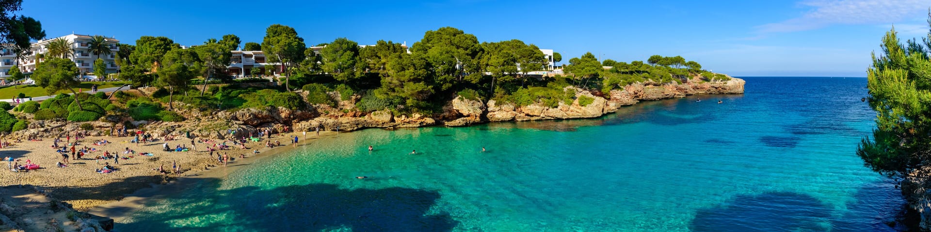 Beautiful wide panorama of Esmeralda beach in Cala d'Or on the coast of Mediterranean sea in Mallorca Balearic Islands