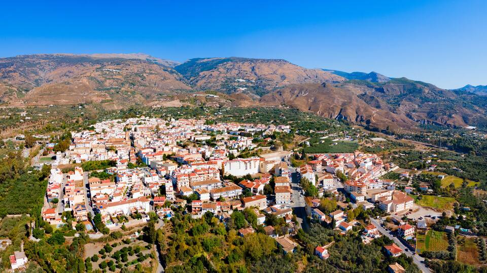 Orgiva town aerial panoramic view in Alpujarras, Spain