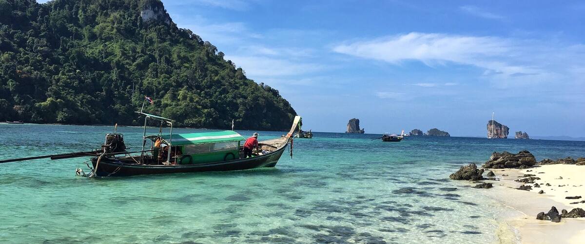 If you go to Krabi or Phuket, Thailand rent a private long-tail boat and head to islands that aren't frequented by so many tourists. You still have to hit some of the more traveled islands... They are on the beaten path for a reason. This is Tup Island with our long-tail boat.  
#BeachBound