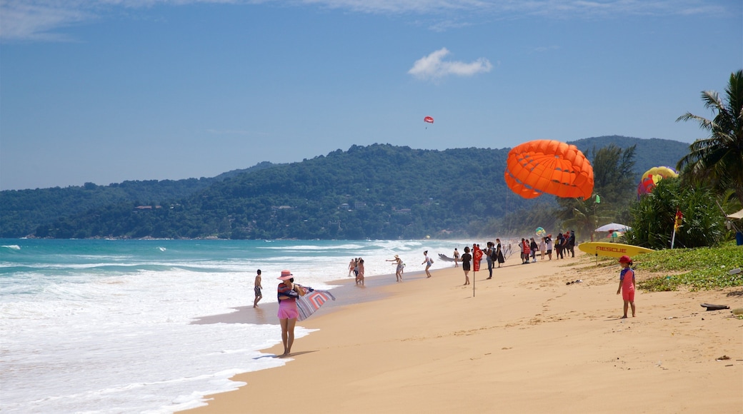 Karon Beach showing general coastal views and a sandy beach as well as a small group of people