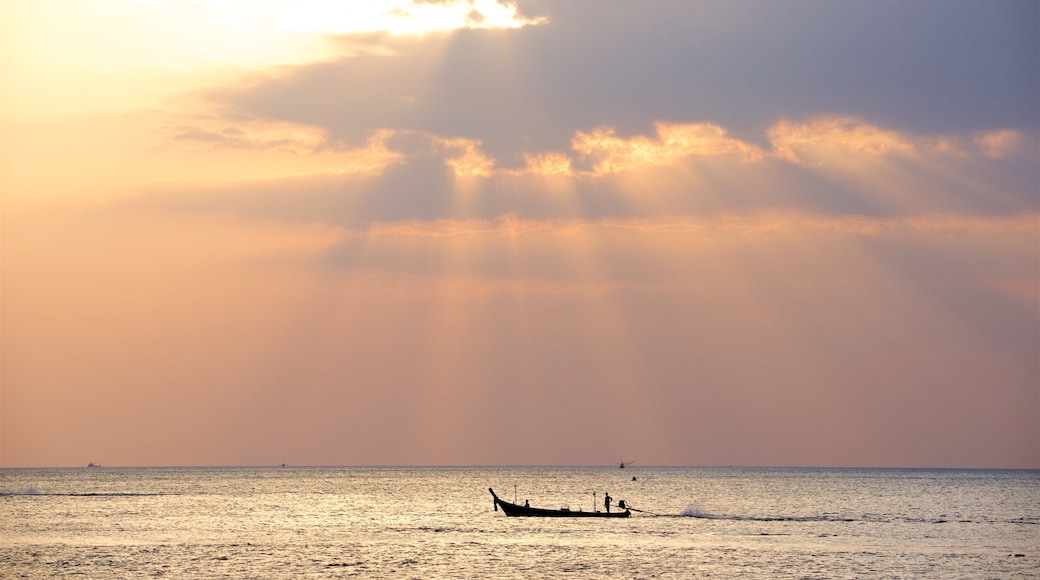 Karon Beach featuring boating, a sunset and general coastal views