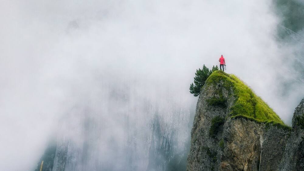 We took the first cable car up at 7am, and after a short 1h walk arrived to this place. It was changing from complete white out to clear sky for a minute, and then getting white again for an hour. Nevertheless, I took quite a lot of photos in this weather, as it felt so magical with the mist partially covering this beautiful rock formation. To get to this point of view, we had to walk along exposed ridges on a narrow path, in very wet and knee deep grass. Definitely, an #adventure worth waking up for.