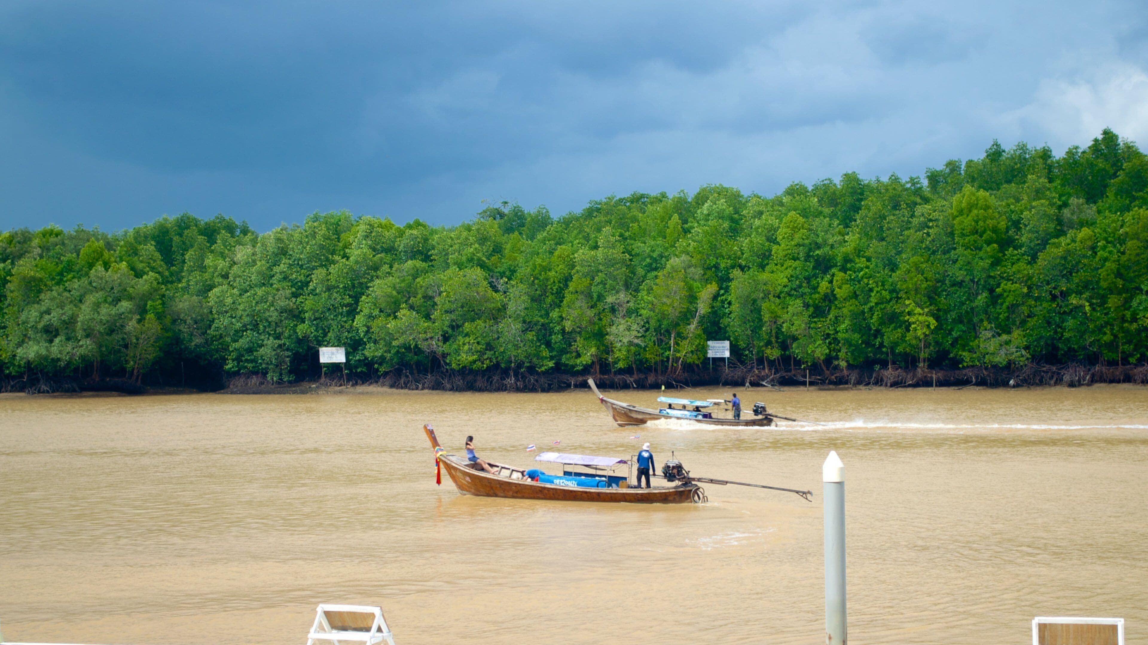 Downtown Krabi showing boating and a river or creek