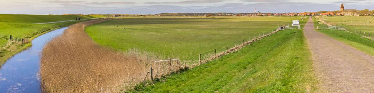 Panorama of sunset over the landscape and Hollum village in Ameland, Netherlands