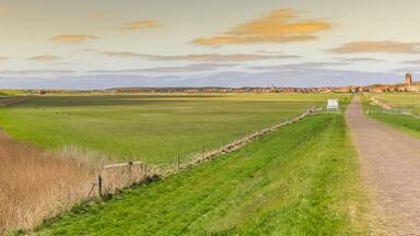 Panorama of sunset over the landscape and Hollum village in Ameland, Netherlands