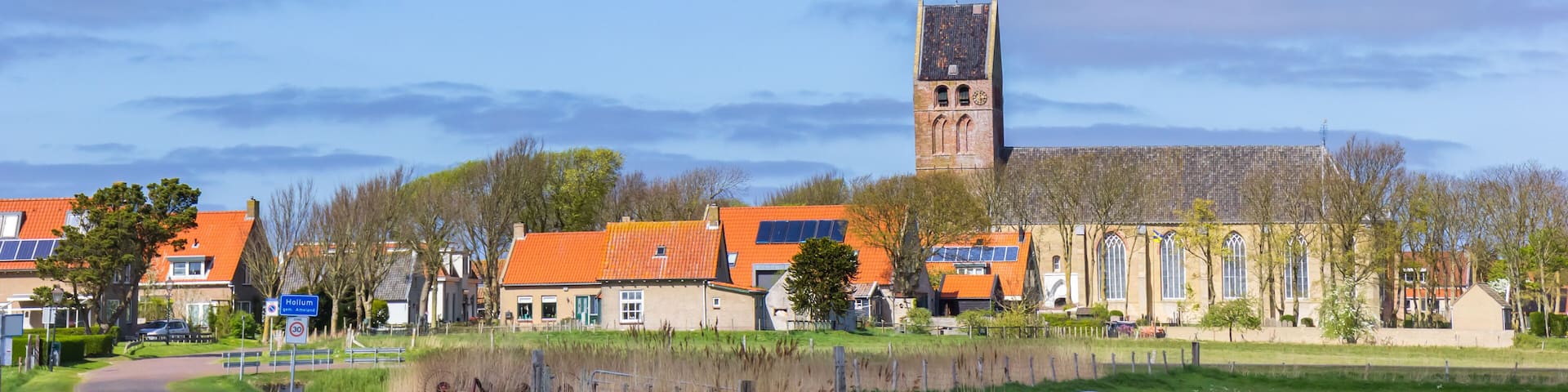 Panorama of the church in the historic village of Hollum, Ameland, Netherlands