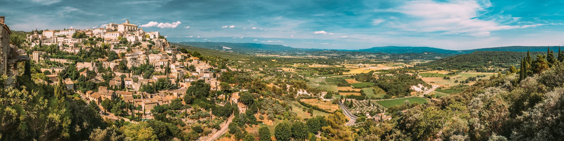Gordes, Provence, France. Beautiful Scenic View Of Medieval Hilltop Village Of Gordes. Sunny Summer Sky. Famous Landmark. panorama scenic view