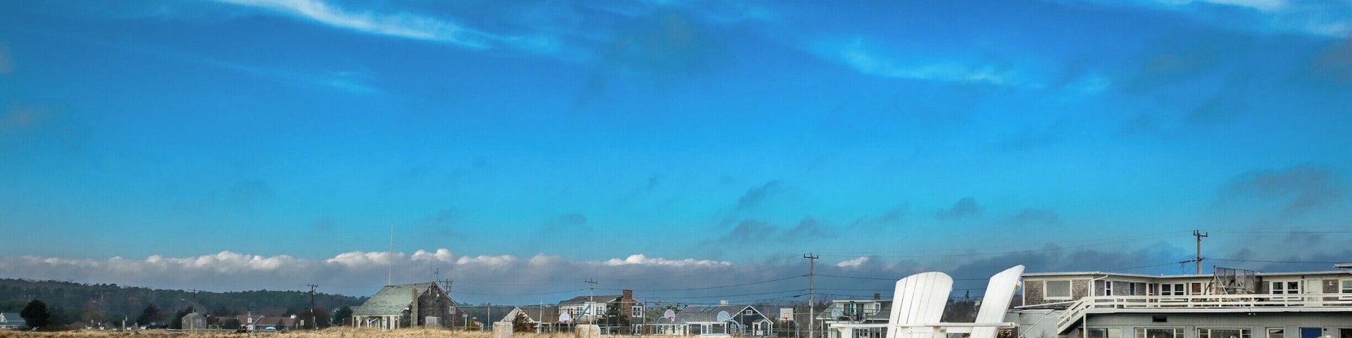 Those Adirondack chairs offer a great vantage point, viewing the commercial fishing vessels sailing in and out of Wellfleet Harbor.