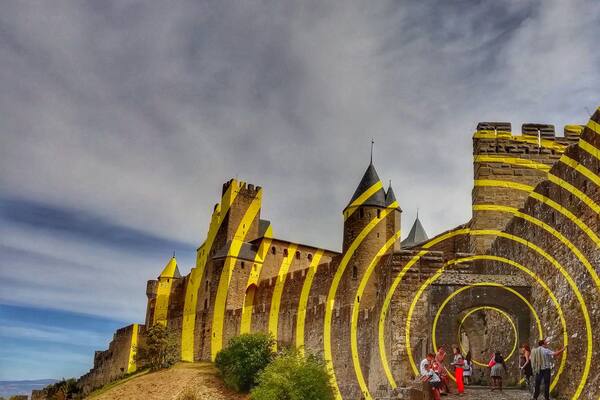 This is one of the entryways to the medieval city at Carcassonne. When I visited, it had this art installation - those circles are physically there!