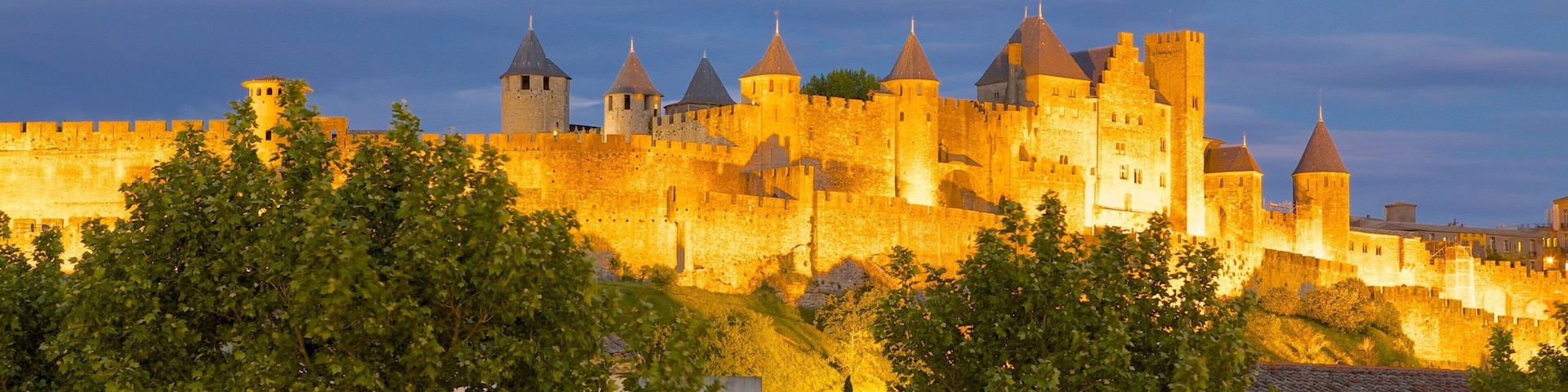Carcassonne showing heritage architecture, chateau or palace and night scenes