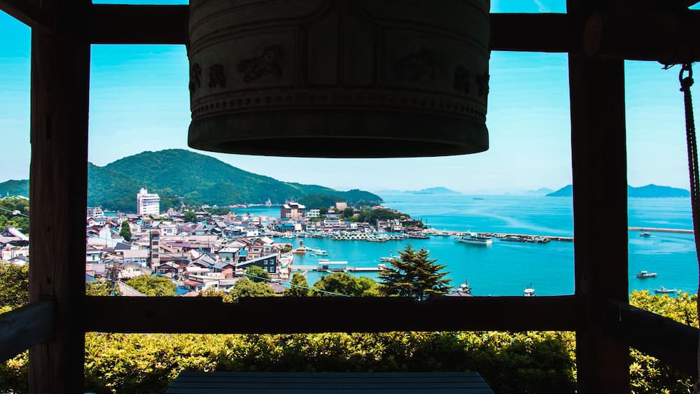 Tomonoura Port town and Seto Inland Sea landscape view from behind Io-ji or Ioji Temple bell. Fukuyama, Hiroshima Prefecture, Japan.